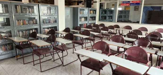 a room filled with lots of desks and chairs